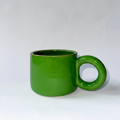 Green mug on a white background